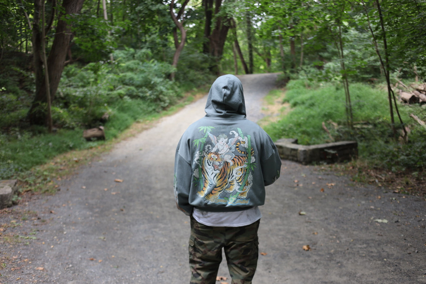 Heavyweight Drop Shoulder Full Zip Hoodie – “Tiger & Angels” Graphic Streetwear worn in nature on a winding path.