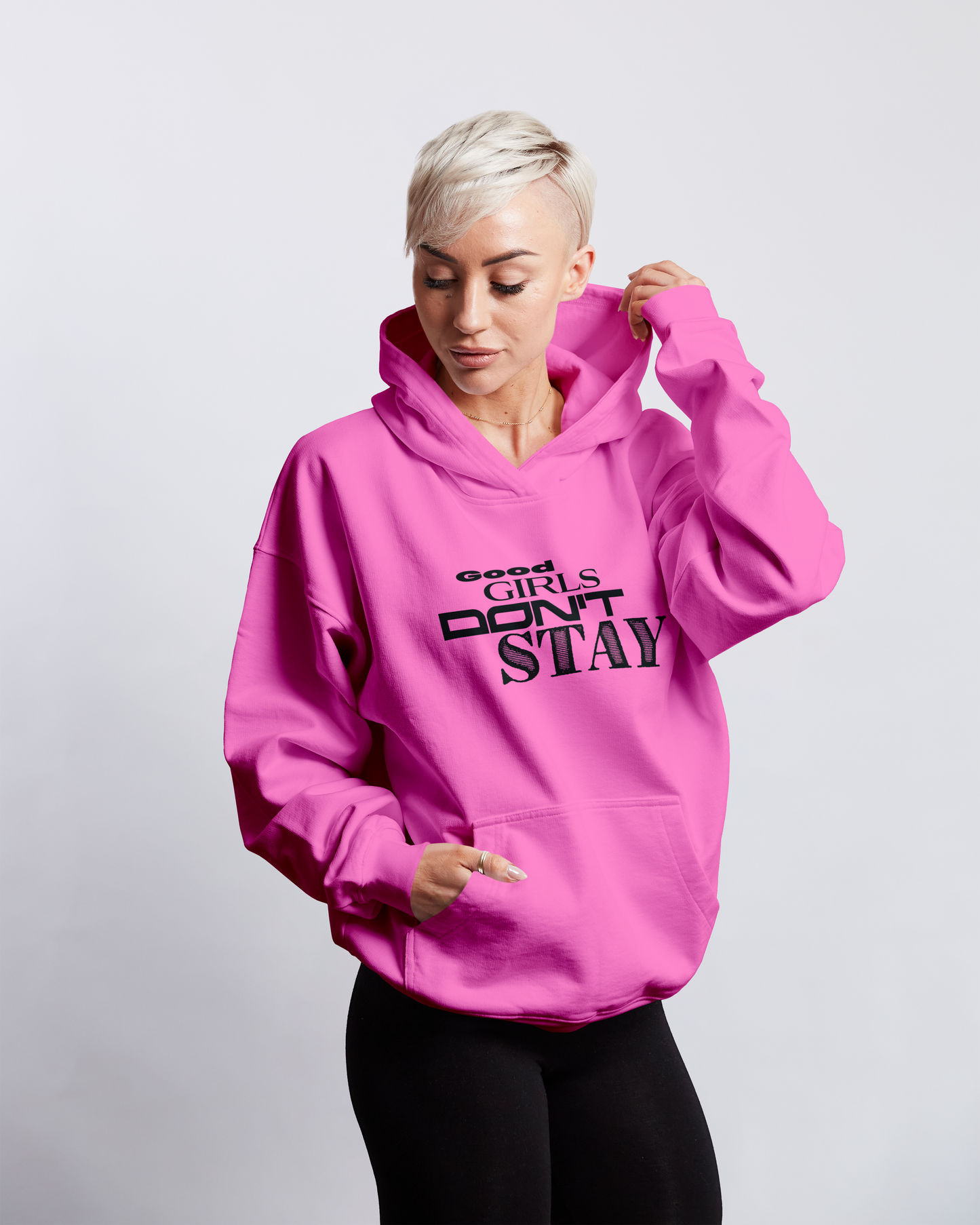 Person wearing a pink hoodie with text on a light gray background